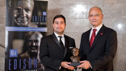 Marco Maia on the left and F. Javier Diez-Garias on the right holding an award together
