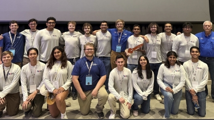 Large group of students with first row kneeling in front of second row