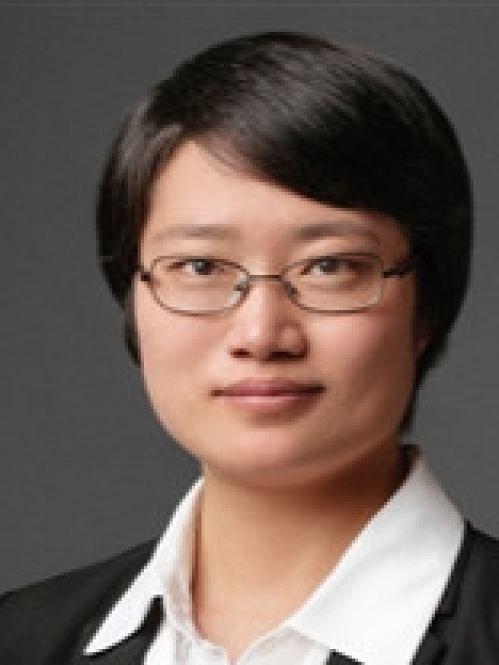 Head shot of Asian woman with black hair and eyeglasses.